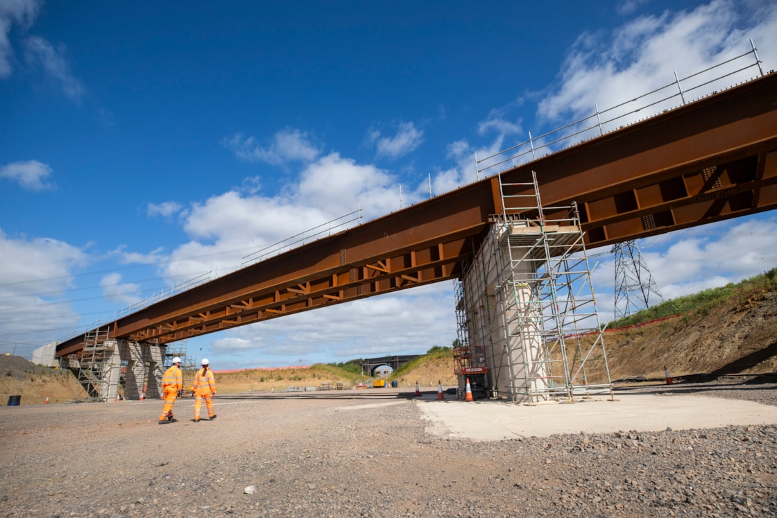 Steel beams in place for the new Edgcott Road overbridge looking south towards the original bridge July 2024