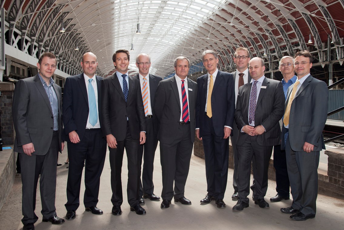 Celebrating investment on the Great Western: From left to right:
Martin Treacy, project manager, Network Rail
Mike Gallop, principal programme sponsor, Network Rail
Andrew Craig, scheme project manager, Network Rail
David Higgins, chief executive, Network Rail
Robbie Burns, major programme director, Network Rail
Rt Hon Philip Hammond MP, secretary of state for transport
Patrick Hallgate, route managing director, Network Rail
Mark Hopwood, managing director, First Great Western
David Holloway, project engineer, Network Rail
Paul Futter, programme manager, Network Rail