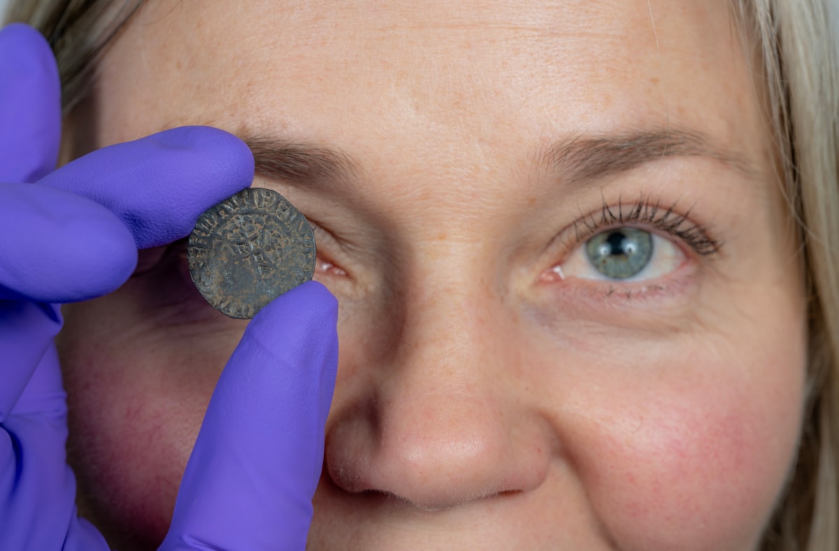 Curator Alice Blackwell inspects the David I penny. Image © Neil Hanna (2)
