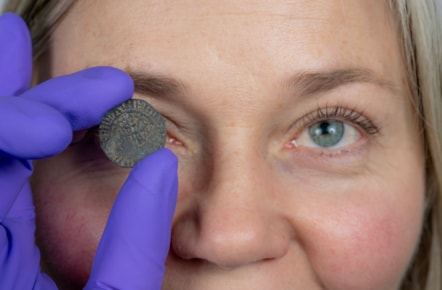 Curator Alice Blackwell inspects the David I penny. Image © Neil Hanna (2)