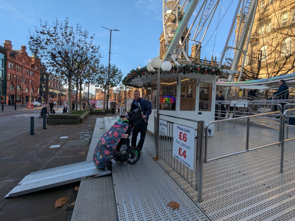 Wheel of Light: Steven Lightfoot and his daughter Zoe, 10, visit the Wheel of Light to try the new accessible gondola.
The new gondola—delivered through a collaboration between International Funfairs, Leeds City Council, and wheel owner John Noyce—can accommodate one wheelchair user and two accompanying guests.