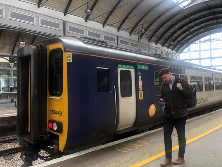 This image shows the new whatsapp service being used next to a Northern train