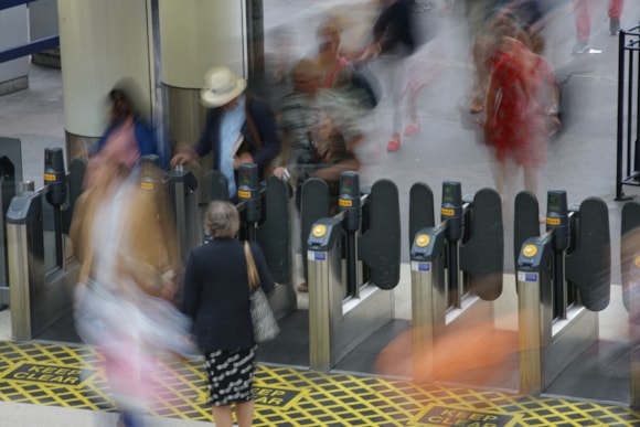 Pay as you go with contactless rolls out at 12 more South Western Railway stations from February: Customers going through ticket gates at Waterloo station 3