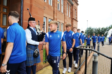 KFC Youth Team under 18's arriving with Stuart McCallum on the bagpipes
