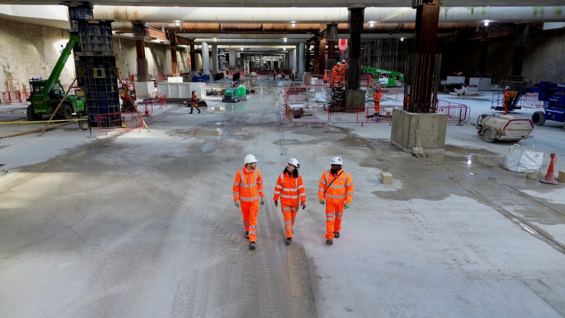 Foundations complete for HS2's Old Oak Common high speed station-2: Workers walk across the competed base slab in the 850m long underground station box at Old Oak Common. 
L-R: Russell D'Urso, HS2 Project Manager, Kitty Bulmer- BBVS Assistant Package Manager, Raj Alagenthirarajah – Expanded Senior Site Engineer