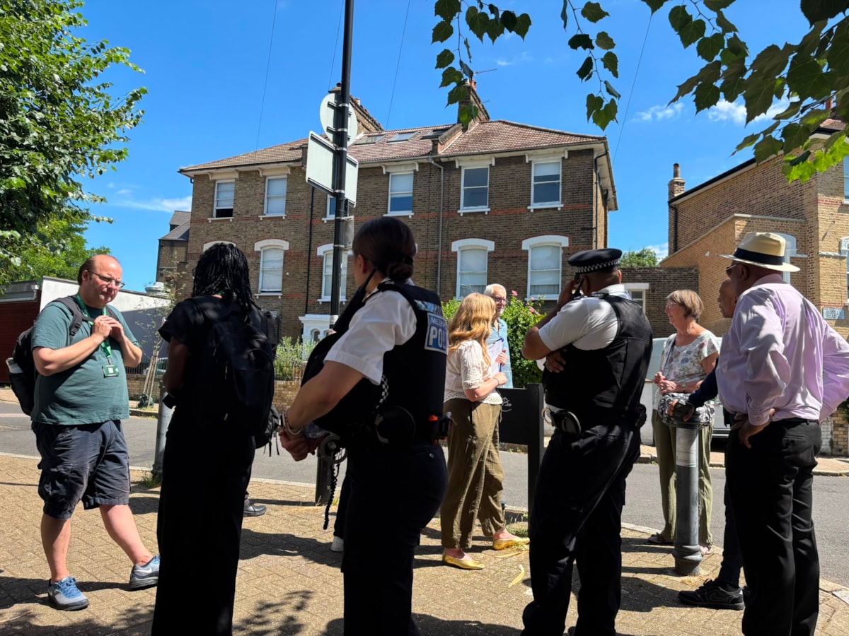 A group of residents, police and neighbourhood patrol teams on a community walkabout in Islington