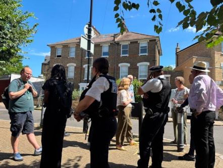 A group of residents, police and neighbourhood patrol teams on a community walkabout in Islington
