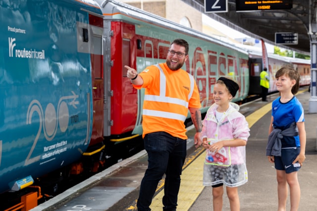 Volunteer with children on Margate station platform: Volunteer with children on Margate station platform