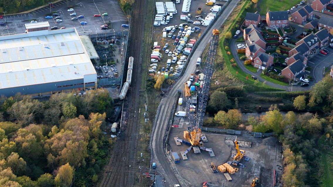 Aerial shots reveal 800-tonne crane set to lift derailed cement wagons: Network Rail helicopter shot of Carlisle derailment and 800-tonnne crane