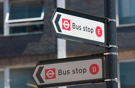A stock image of two 'bus stop' signs