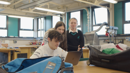 F1 in Schools group around computer