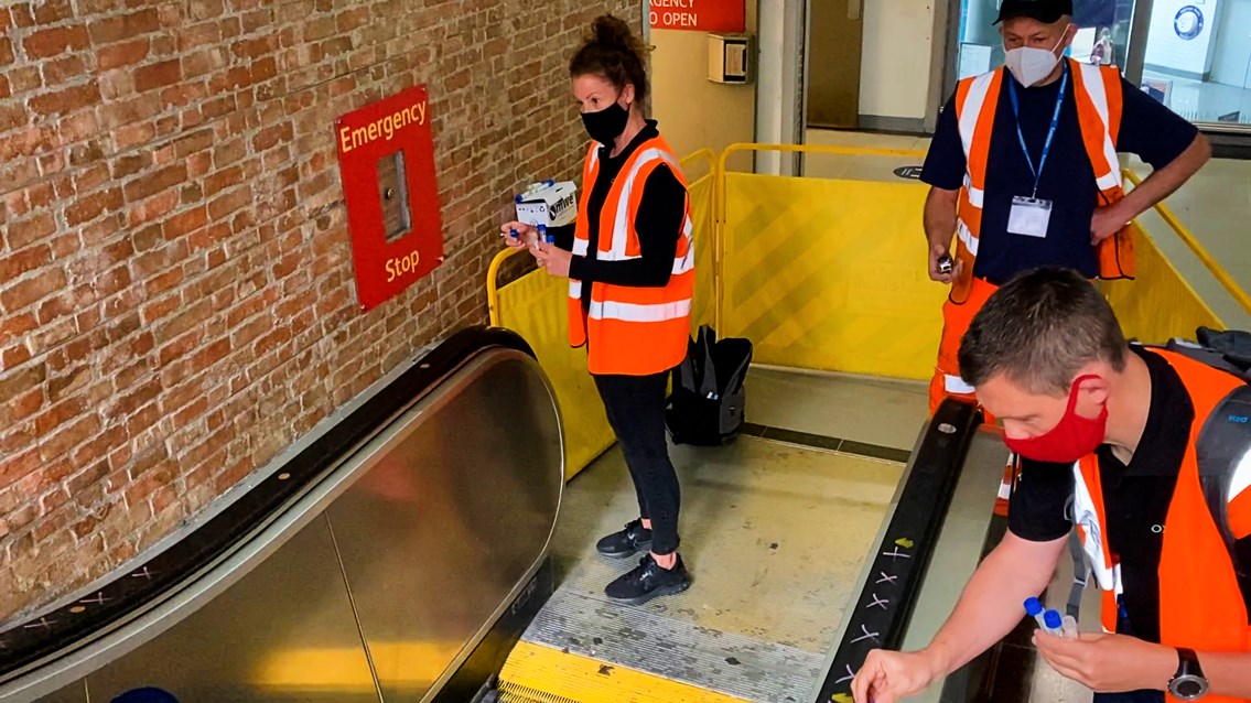 Teams analysing the effectiveness of the OXONOX escalator sanitising system at Manchester Piccadilly