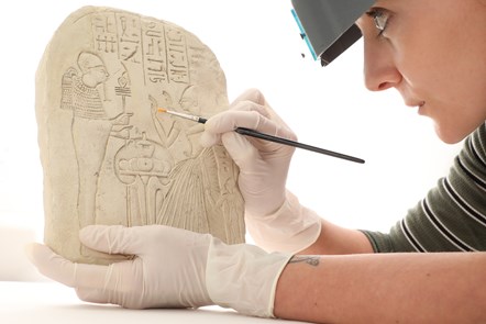 Assistant conservator Bethan Bryan works on an ancient Egyptian stela. Photo ©  Stewart Attwood