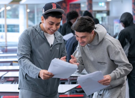 Laith and Luis, two students from Cardinal Pole, looking at their GCSE results