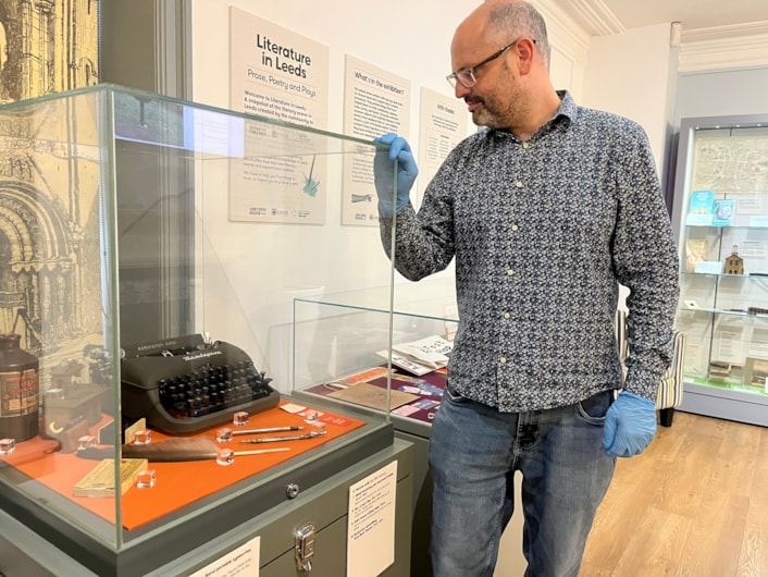 Literature in Leeds: Curator Patrick Bourne with some of the exhibits which feature in Literature in Leeds at Kirkstall’s Abbey House Museum, which showcases objects, memorabilia and personal stories which have inspired a generation of modern-day writers to create works enjoyed by audiences around the world.