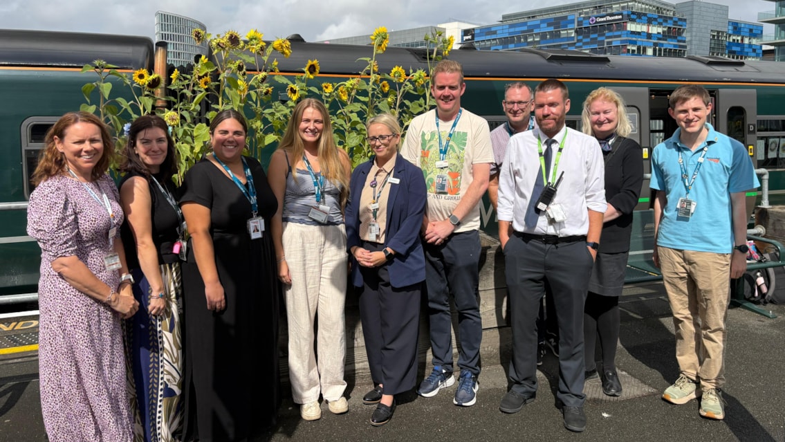 Special ‘Sunflower Train’ brings communities together along the Severn Beach line: The sunflowers at Bristol Temple Meads with rail staff and project partners