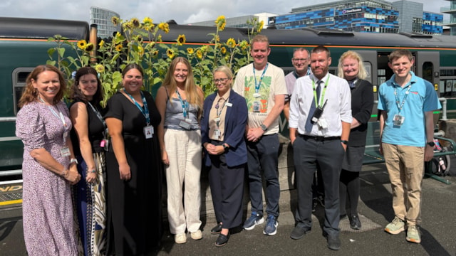 Special ‘Sunflower Train’ brings communities together along the Severn Beach line: The sunflowers at Bristol Temple Meads with rail staff and project partners