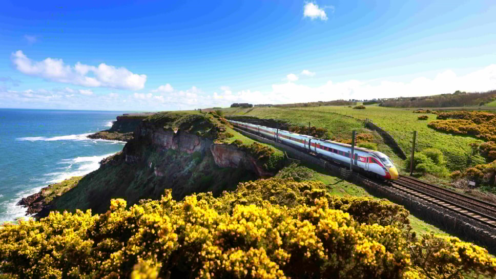 Summertime, an LNER Azuma along the Northumberland coastline, credit LNER (1) cropped
