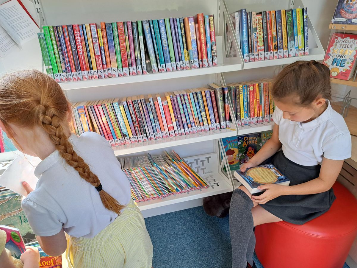 Pupils from Woodland Community Primary School in Skelmersdale enjoy the books in the school mobile bus which has come to visit.-4