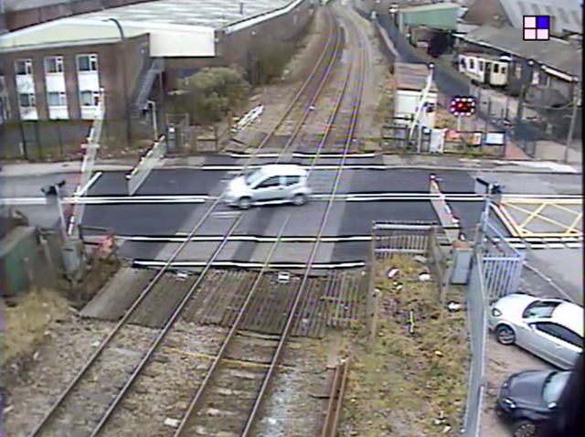 Shocking video shows motorist swerving around safety barriers at Black Country level crossing: Langley Green level crossing still
