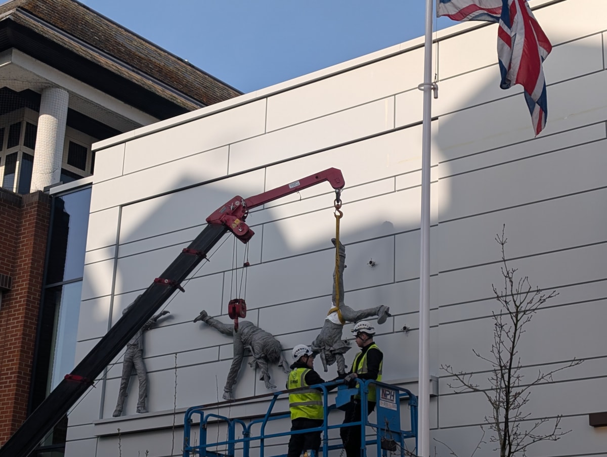 Final figure lifted into place