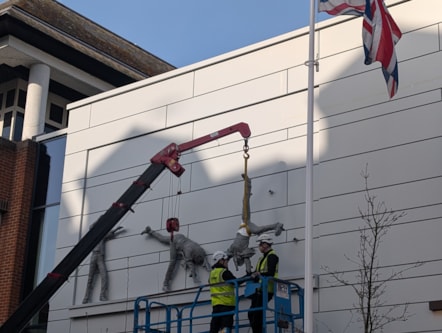 Final figure lifted into place