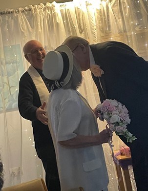 Donald and Margaret share a kiss at the wedding blessing on Valentine's Day