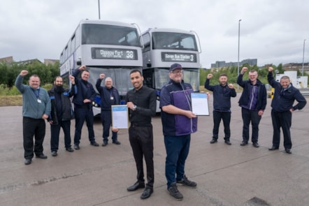 Colleagues cheer Mansour (left) and Alex on their awards