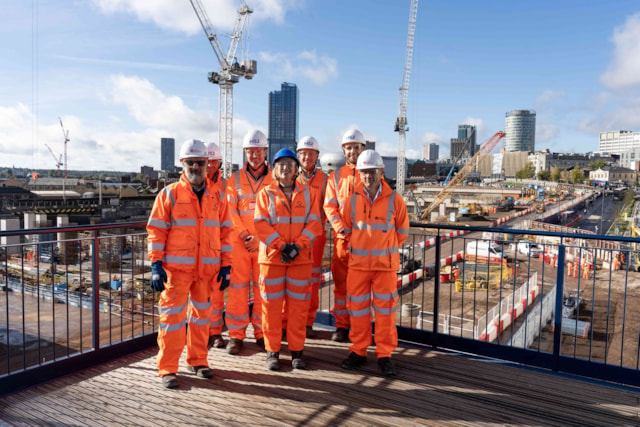 Curzon Street Tram handover to TfWM 24009 small: HS2, TfWM and MMA staff on a platform overlooking the land being handed over. The current tram terminus at Millennium Point is to the right of the picture. (Picture: HS2)