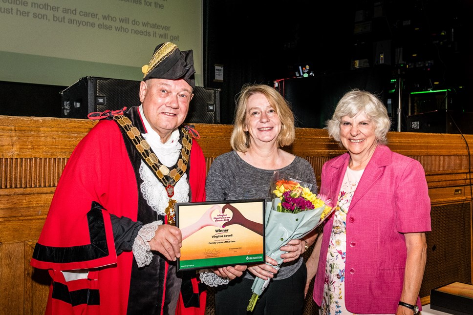 Carer Virginia Bovell is presented with her award by the Mayor of Islington and Cllr Janet Burgess