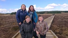 Blawhorn boardwalk extension opens: Blawhorn Moss Reserve Manager Amee Hood and Dr Heather Reid with pupils from Blackridge Primary School on the new boardwalk extension.