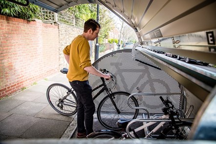Islington's bike hangars can store six bikes at a time, and take up half of a typical car parking space: Pictured is Bart Smith (Active Travel Programme Officer at Islington Council)