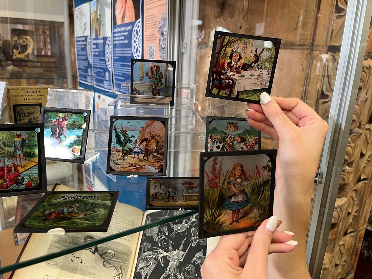 Magic lantern slides: Rhian Isaac, special collections librarian at Leeds Central Library, with the vintage magic lantern slides featuring moments from classic tales including Alice in Wonderland, Peter Pan and Aladdin.