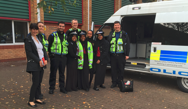 Rail industry is working together to remind people in Wales and the borders to stay safe: Cardiff Councillor Sarah Merry, BTP officers and Fitzalan High School pupils learning about level crossing safety during Rail Safety Week 2017
