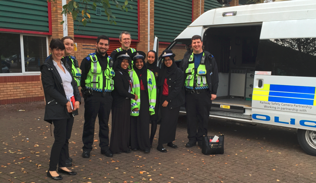 Cardiff Councillor Sarah Merry, BTP officers and Fitzalan High School pupils learning about level crossing safety during Rail Safety Week 2017