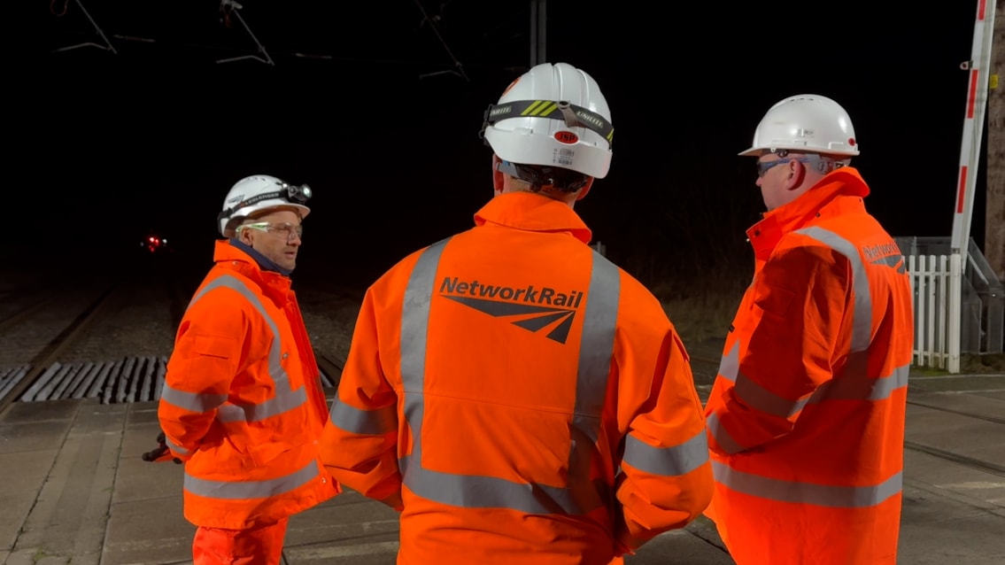 Team at Floriston level crossing which has been improved during the work