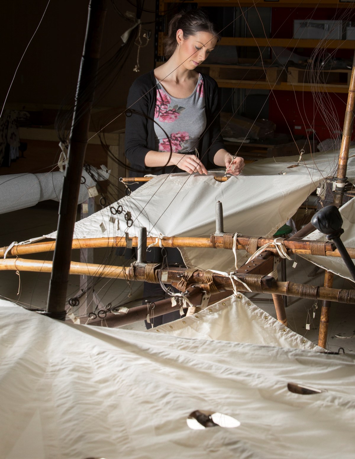 A conservator works on Pilcher's Hawk at the National Museums Collection Centre. Photo © National Museums Scotland