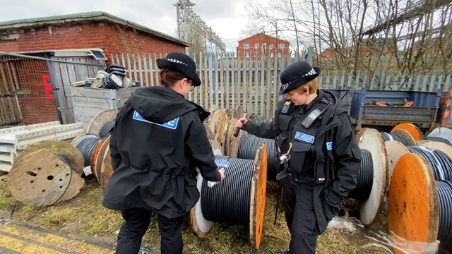 BTP officers marking and checking cable reel for SelectaDNA