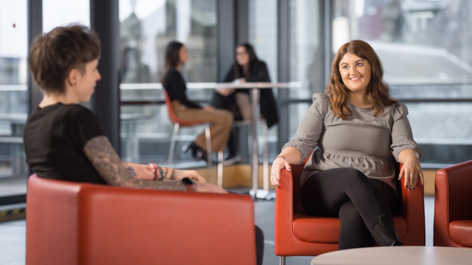 Female colleagues talking