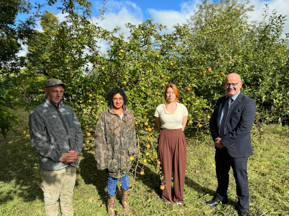 From left, Pennine Oaks members Saba and Bobby, LCC Treescapes team member Jenni and Councillor Shaun Turner, cabinet member for Environment and Climate Change at the orchard in Barrowford