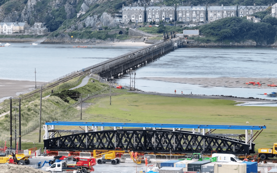 VIDEO: Successful test lift of 160-tonne metallic span marks countdown to final stage of Barmouth viaduct restoration: New span with viaduct backdrop Barmouth HERO
