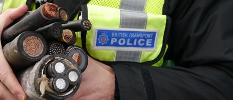 Cross sections of cable being targeted by criminals: British Transport Police officer with the remnants of stolen cable.