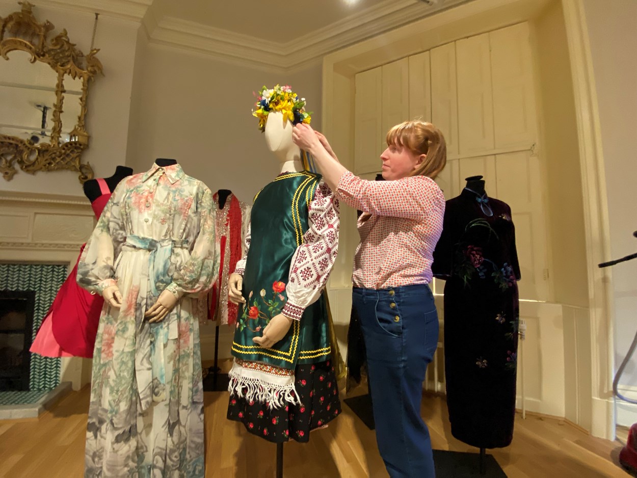 Ukrainian dress loan: Curator Natalie Raw works on the Ukrainian dress in the fashion gallery at Lotherton. From the central region of Ukraine, the costume consists of an embroidered shirt called a Vyshyvanka, which is worn along with a Vynok headdress and a sleeveless jacket called a Korstka.