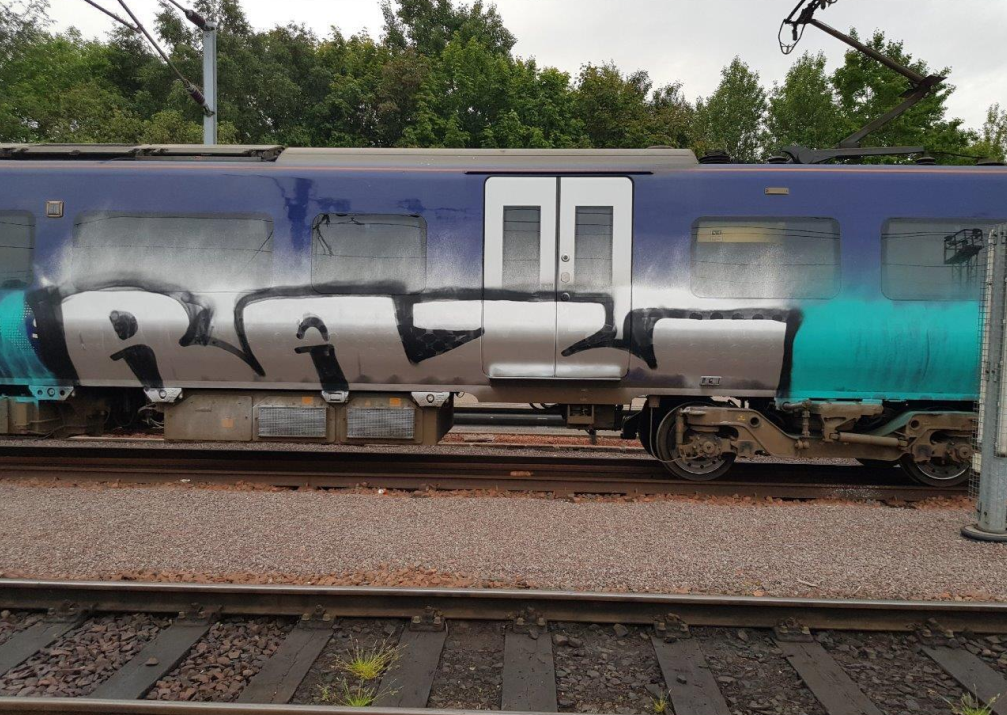 Image shows graffiti on Northern train at Heaton depot