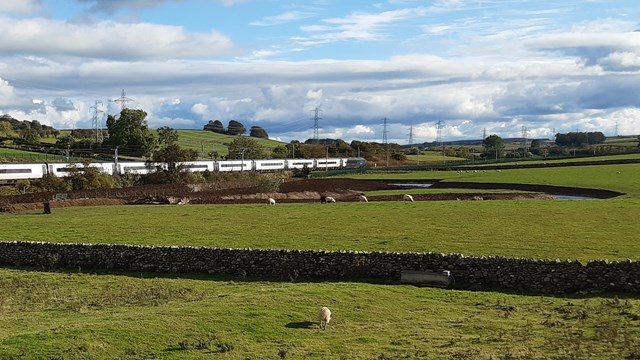 West Coast main line protected as Cumbrian river restored back to its original course: Restored River Leith beside West Coast main line in Thrimby