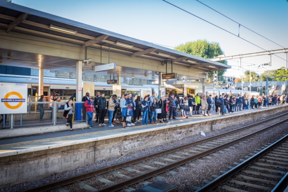 London Overground stations along the future Mildmay line partner with Crisis to fundraise on World Homeless Day: TfL Image - Highbury & Islington London Overground platform at morning peak with participating coffee shop for World Homeless Day in the background