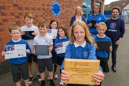 Stuart Guffie from Sonappa, Julie Carrie, Music Service Manager, Martyn Hay, Gargieston Primary with Noah, Alice, Alex and front row Sam, Charlie, Katie and Zoe