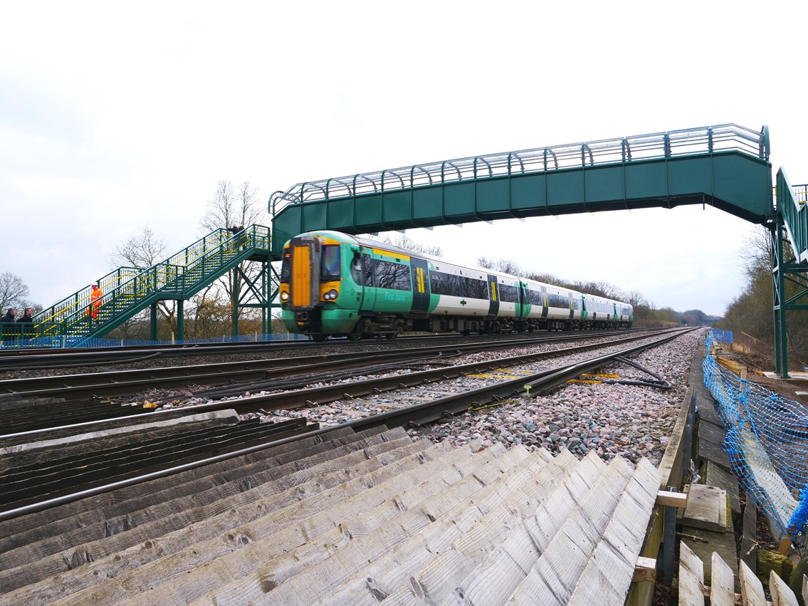 Dean Farm Train: A train to London rushes under the new bridge at 90mph, and over the old crossing