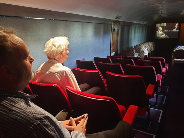 Steve Foxon and father Rob Foxon in the cinema coach. C Martin Rouse