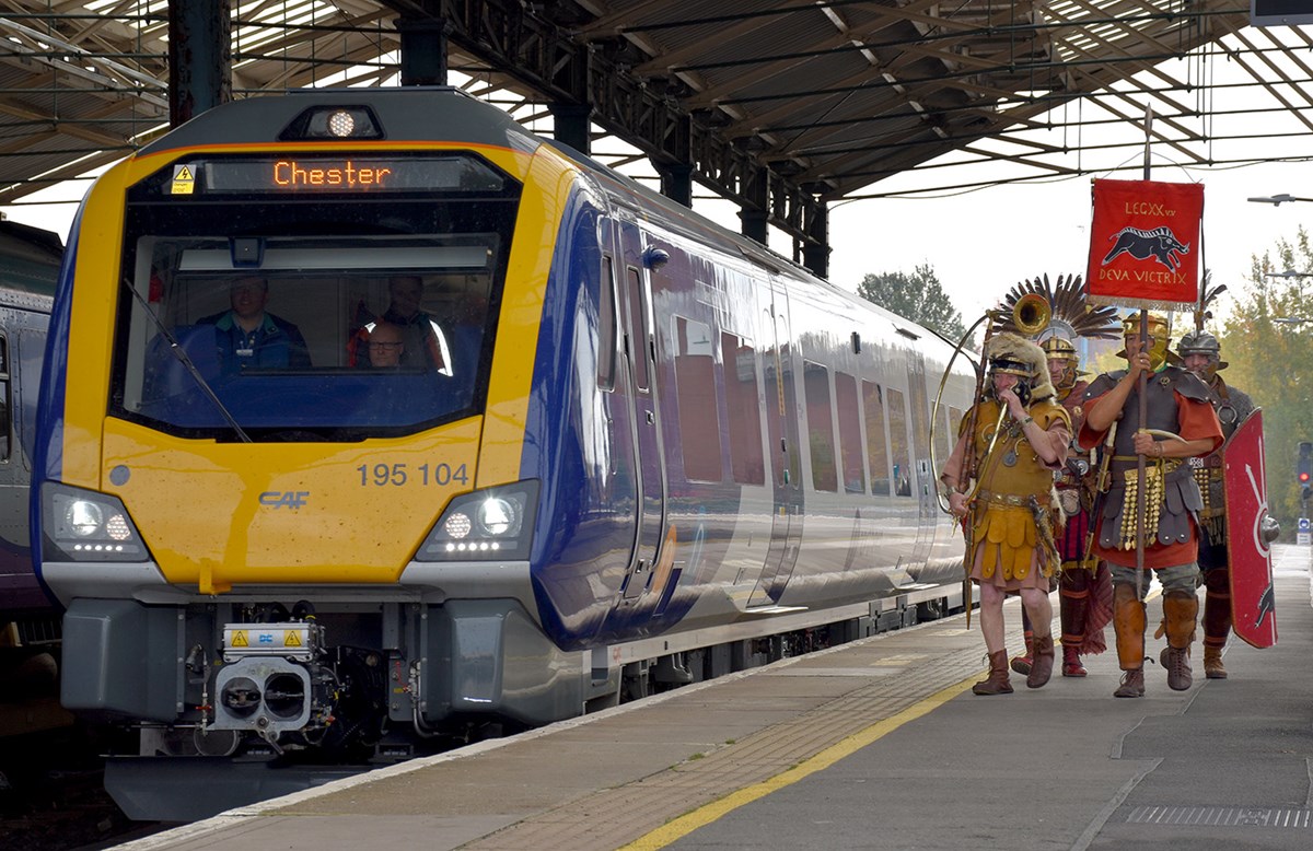 The soldiers of Roman Tours Deva Victrix walk in Northern's new train at Chester station